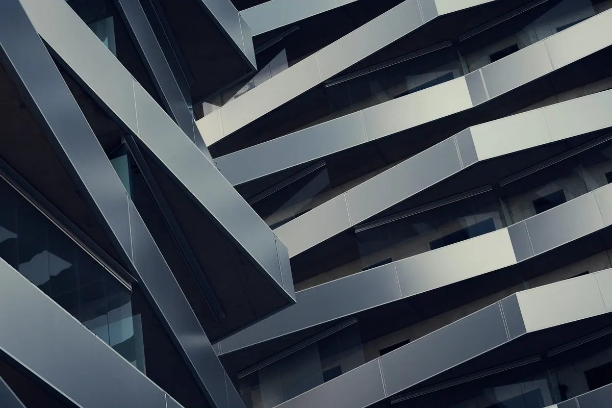 Facade of a modern building with zigzagging balconies.